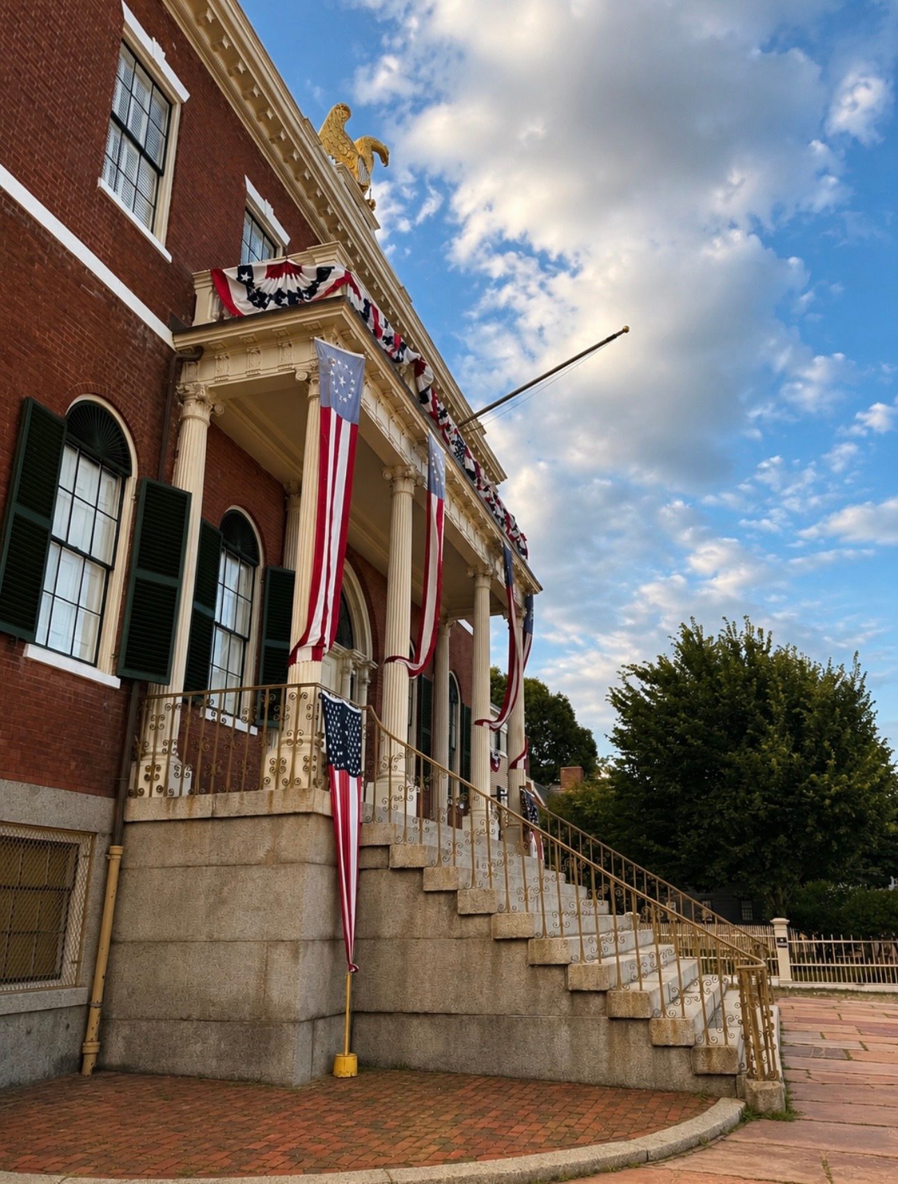 The 1819 Custom House at Salem Maritime National Historic Site, crowned by its gold eagle and draped in patriotic bunting and flags