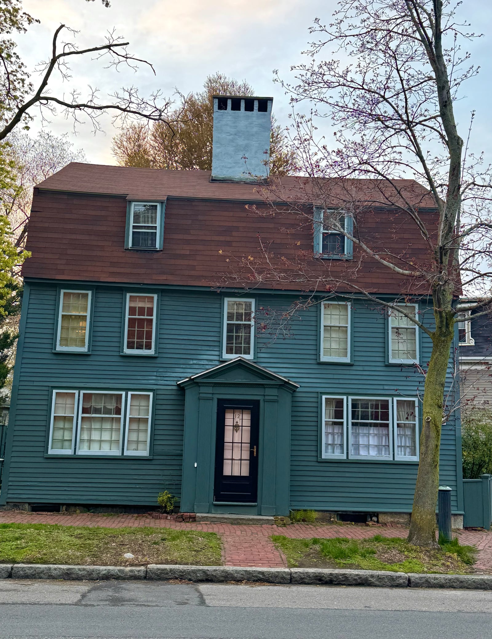 Preserved 18th-century colonial architecture on a tree-lined street in Salem MA