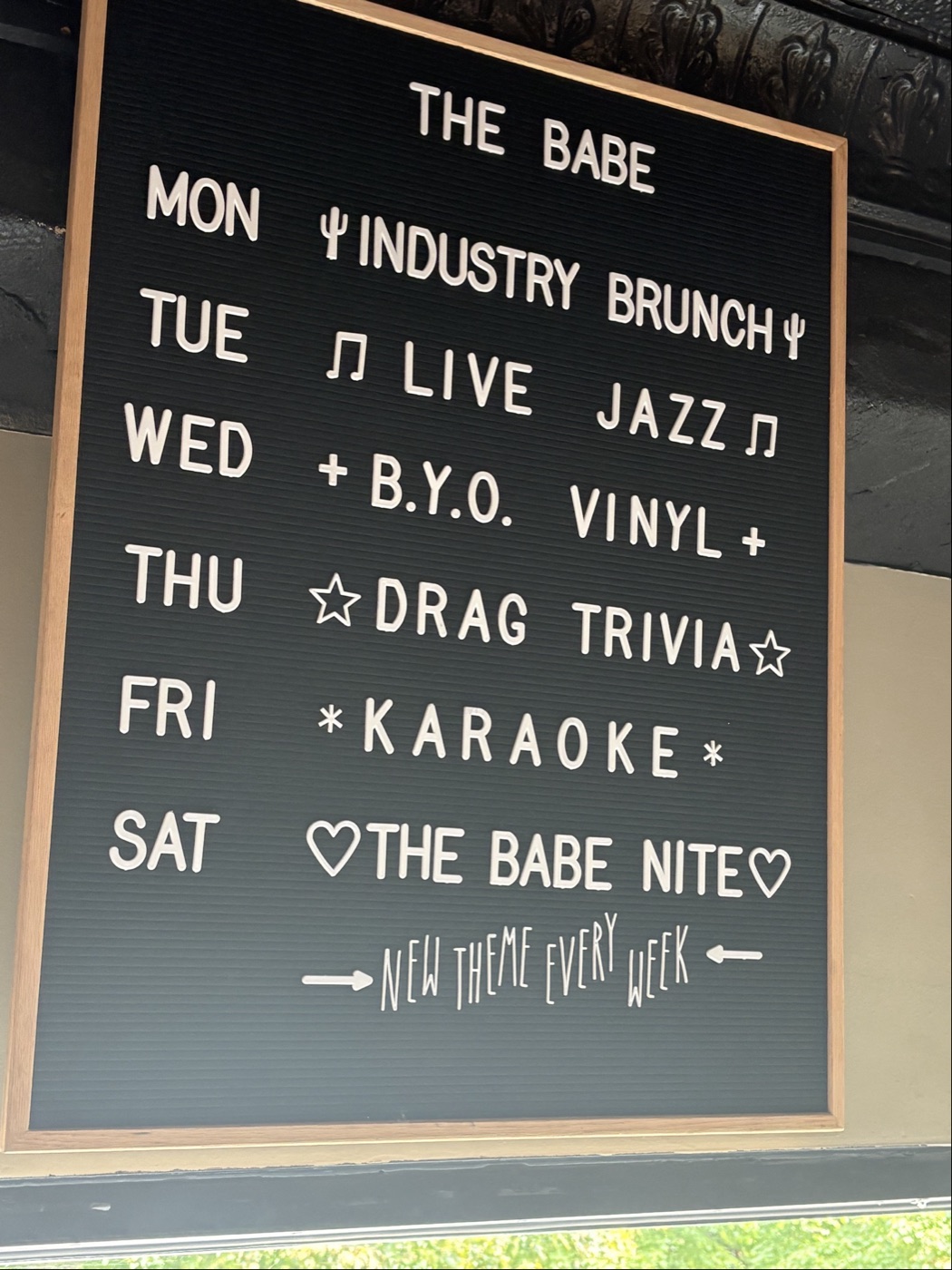 The Babe's weekly schedule letter board: Monday Industry Brunch, Tuesday Live Jazz, Wednesday B.Y.O. Vinyl, Thursday Drag Trivia, Friday Karaoke, Saturday The Babe Nite with a new theme every week