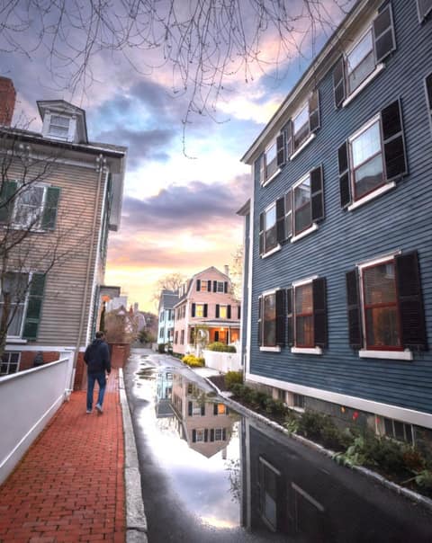 Federal Street historic district at dusk with Federal-style mansions glowing orange in Salem MA